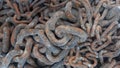 close up view of pile of old, dirty and rusty big and smaller windlass chains Royalty Free Stock Photo