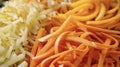 A close-up view of a pile of shredded carrots and onions on a wooden cutting board in a kitchen