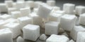 Close up view of a pile of white sugar cubes with one cube floating in the air above the pile Royalty Free Stock Photo