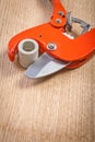 Close up view on pipe cutter with cutted plasticqal pipe Royalty Free Stock Photo
