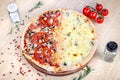 Close up view on pizza on white wooden background with ingridients. Italian cuisine. Royalty Free Stock Photo
