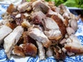 Close-up view of a plate of succulent Chinese crispy skin roast pork pieces Royalty Free Stock Photo