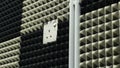A close-up view of plug wall, pipe and wall noise cancellation Royalty Free Stock Photo