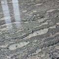 A close-up view of a polished granite surface featuring intricate patterns and textures. Royalty Free Stock Photo