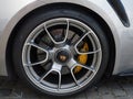 Close-up view of Porsche-front wheel with brakes