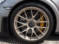Close-up view of Porsche-front wheel with brakes