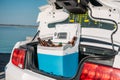 close up view of portable fridge with beer standing