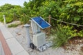 Close-up view of portable solar power station situated along red trail on Walking Street in Miami Beach Royalty Free Stock Photo
