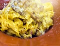 Close-up view of a portion of pasta with carbonara sauce cooked with eggs, bacon and topped with pecorino cheese and parmesan Royalty Free Stock Photo