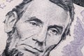 Close up view Portrait of Abraham Lincoln on the one five dollar bill. Background of the money. 5 dollar bill with Abraham Lincoln Royalty Free Stock Photo