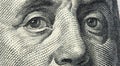 Close up view Portrait of Benjamin Franklin on one hundred dollar bill. Franklin eyes macro. 100 dollar bill with Benjamin Royalty Free Stock Photo