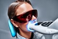 Close-up view portrait of a female patient at dentist in the clinic