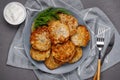 Close up view of potato pancakes. Potatoes pancakes latkes, flapjacks, hashbrown or potato vada on gray plate