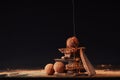 close up view of process of pouring caramel onto truffles and chocolate bars with cocoa powder process