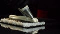 Close-up view of process of preparing roll sushi. Chef in gloves imposes from pastry bag of cream filling on sheet of