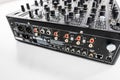 Close-Up View of Professional Audio Mixer Back Panel Connections with Inputs and Outputs