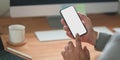 Close-up view of professional businessman looking at his blank screen smartphone Royalty Free Stock Photo