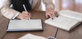 Close-up view of professional businesswoman working on her current project while using digital tablet Royalty Free Stock Photo