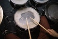 Close-up view of professional drum set and hands