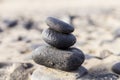 Close up view of a Pyramid from black volcanic stones at the beach. Yellow sand beach in Canary Islands Royalty Free Stock Photo