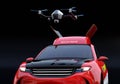 Close-up view of quadcopter drone take off from electric rescue SUV