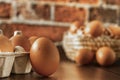 Close-up view of raw chicken eggs on wooden background. Fresh farm egg. eggs in carton box. Royalty Free Stock Photo