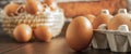 Close-up view of raw chicken eggs on wooden background. Fresh farm egg. eggs in carton box. Royalty Free Stock Photo