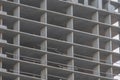 Close-up view of a raw, under-construction building with a concrete skeletal grid structure, taken from ground level The image Royalty Free Stock Photo