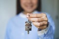 Close up realtor broker holding home keychain in his hand