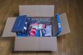 Close up view of received home delivery box with various shoes.