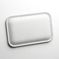 A close-up view of a rectangular, textured, metallic object with a stitched border Royalty Free Stock Photo