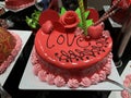 Close-up view of red ÃÂake with sign Love