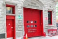 Close up view of red entrance door to Chicago Fire Department. USA.