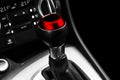 Close up view of a red gear lever shift. Manual gearbox. Car interior details. Car transmission. Soft lighting. Abstract view. Car Royalty Free Stock Photo