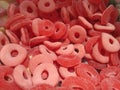 Close up view of red gummy fruit jelly ring in sugar, Candy background Royalty Free Stock Photo