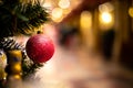 Close-up view of red sparkle ball as decoration hanging on the branches of a Christmas tree and sparkling. Royalty Free Stock Photo