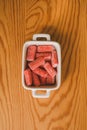 Close up view of red sugary candy on wooden background. Jelly sweets in a bowl. Royalty Free Stock Photo