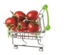 Close up view of red  tomatoes in shopping cart on white background isolated Royalty Free Stock Photo