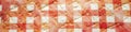 Close-up view of red and white checkered pattern on worn surface Royalty Free Stock Photo