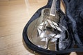 Close-up view of resonator guitar in carry case Royalty Free Stock Photo