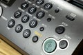 A close-up view of a retro telephone with an answering machine. The device features a numeric keypad, buttons for fax and copy Royalty Free Stock Photo