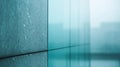 A close-up view reveals a textured wall adorned by a sleek glass window, casting reflections and inviting light into the Royalty Free Stock Photo