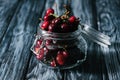 close-up view of ripe sweet healthy cherries in glass jar Royalty Free Stock Photo