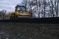 Close up view of a road roller working on a new road construction site. Royalty Free Stock Photo