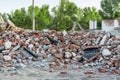 Close-up view ruins of old demolished industrial building. Pile of concrete and brick rubbish, debris, rubble and waste of Royalty Free Stock Photo