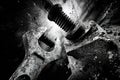 Close-up view of a rusty wrench and bolt with dramatic lighting and textures in black and white Royalty Free Stock Photo