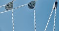 Close-up view of sailboat ropes at sunny weather, pulleys and ropes on the mast, Yachting sport, ship equipment, sea is