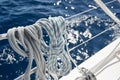 Close-up view of sailboat ropes at sunny weather, pulleys and ropes on the mast, Yachting sport, ship equipment, sea is Royalty Free Stock Photo