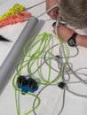 Close-up view of a sailor sets up a sports boat, set of ship equipment, ropes for management of the sailboat of