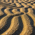 Close up view of a sandy surface with ripple patterns formed by wind or water Royalty Free Stock Photo